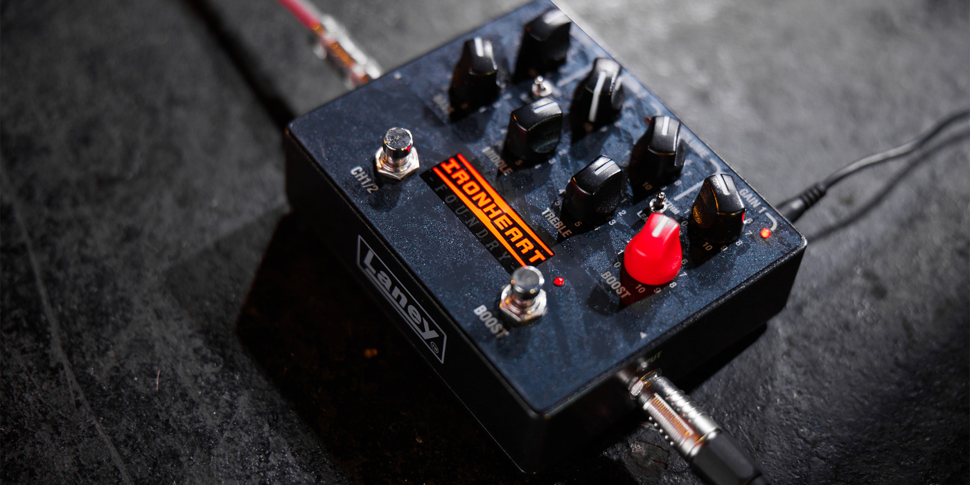 A photo of a Laney IRF-LoudPedal pedalboard amp on a black stage floor, a popular ampless guitar rig