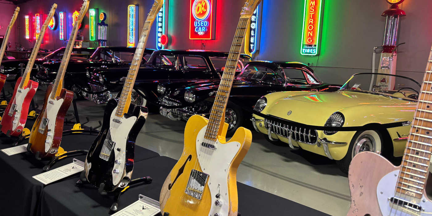 A photo showing Fender Telecaster guitars and American muscle cars at the NAMM 2026 Fender Custom Shop event
