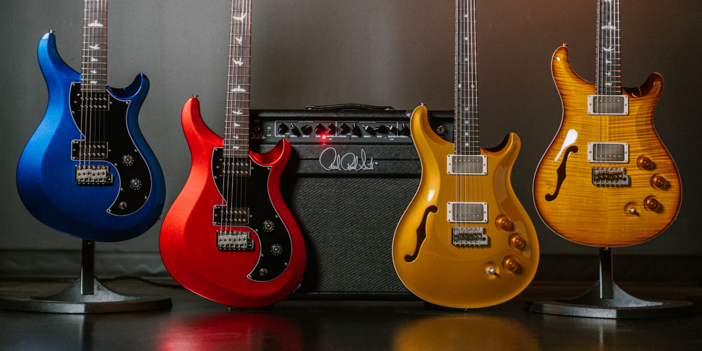A lifestyle photo showing PRS Guitars gear launched at NAMM 2026, including the DGT Semi-Hollow, S2 Vela HHT and Archon Classic 50 Combo Amp