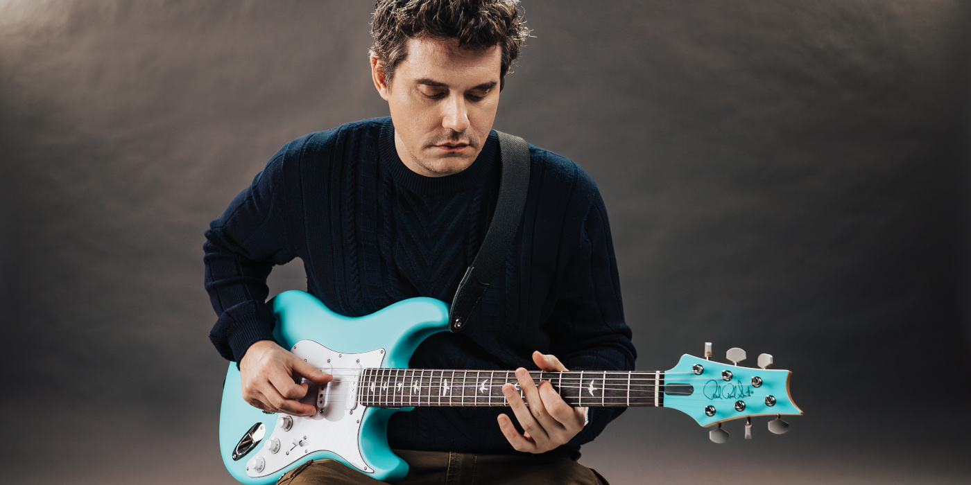 Photo of John Mayer playing the PRS Silver Sky Wild Blue guitar