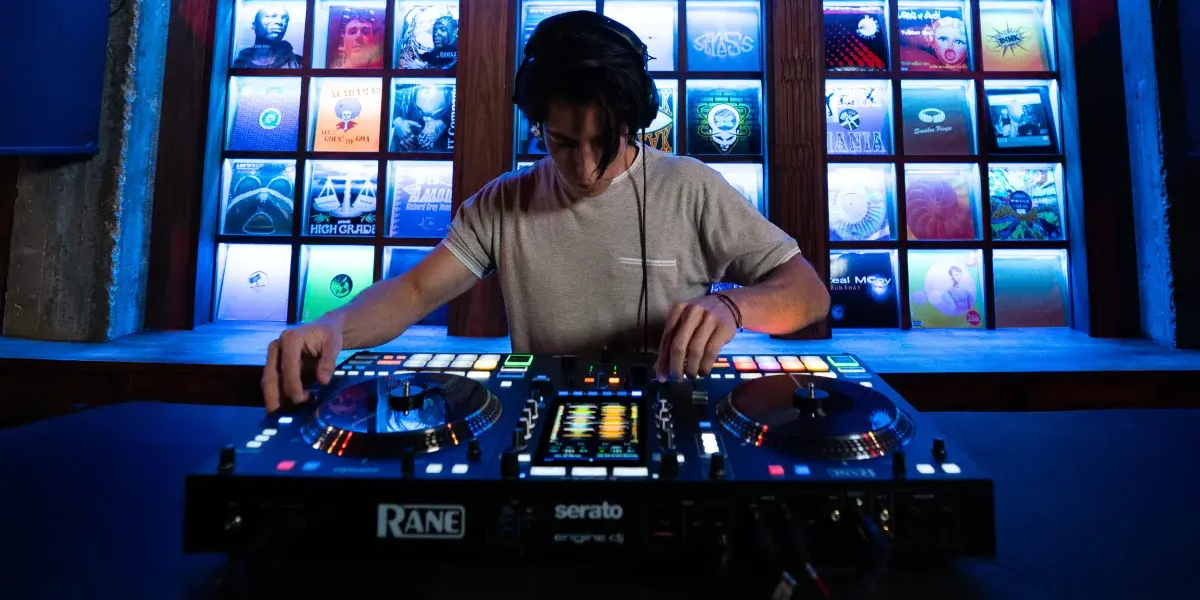 A lifestyle photo of a DJ using the RANE System One launched at the NAMM Show 2026
