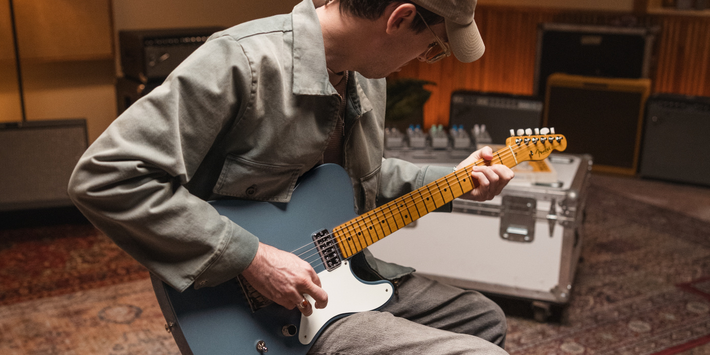 A male guitarist playing the Fender 75th Anniversary American Professional Classic Cabronita Telecaster in a studio