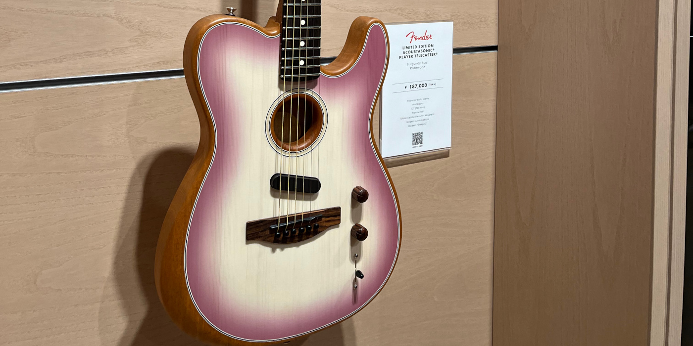 A close up photo of the Japan exclusive Fender Acoustasonic Telecaster in Burgundy Burst