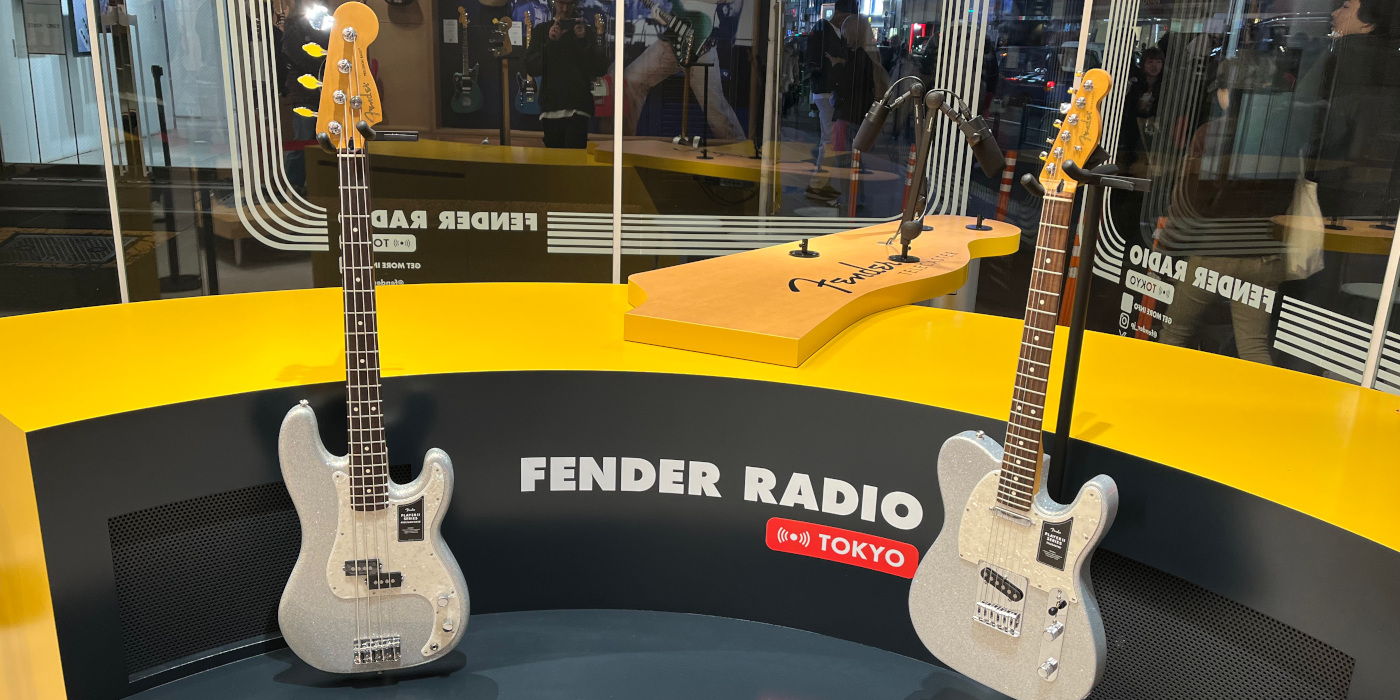 The Fender 75th Anniversary Player II Telecaster and Precision Bass in Diamond Dust Sparkle on stands next to each other