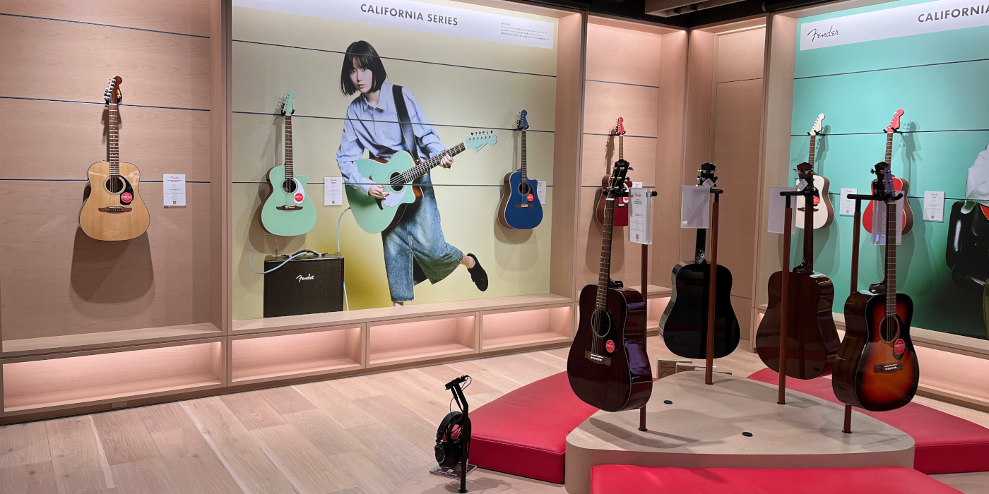 A photo showing the basement floor of the Fender Tokyo store with various acoustic guitars on display