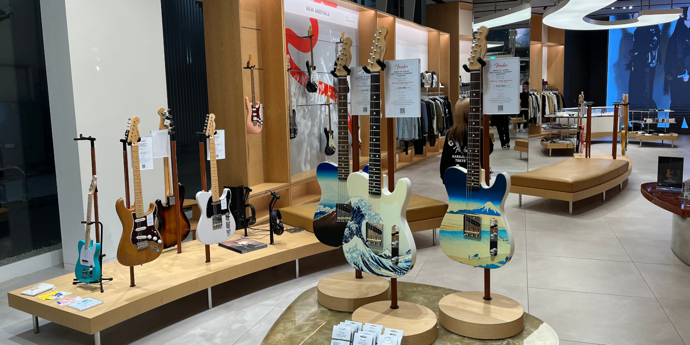 A photo inside floor one of the Fender Tokyo store, showing various Telecaster and Esquire guitars