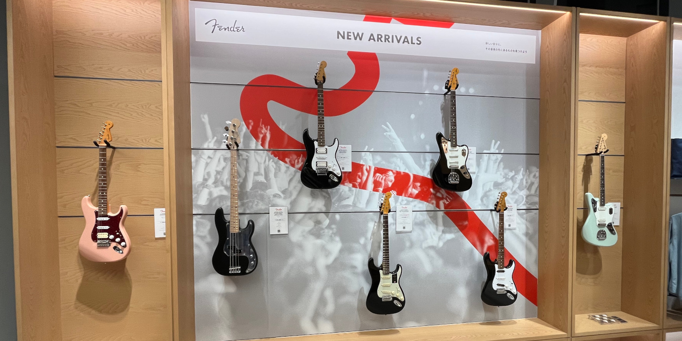 The new arrivals display in the Fender Flagship Tokyo store, showing various Iron Maiden and Johnny Marr signature guitars