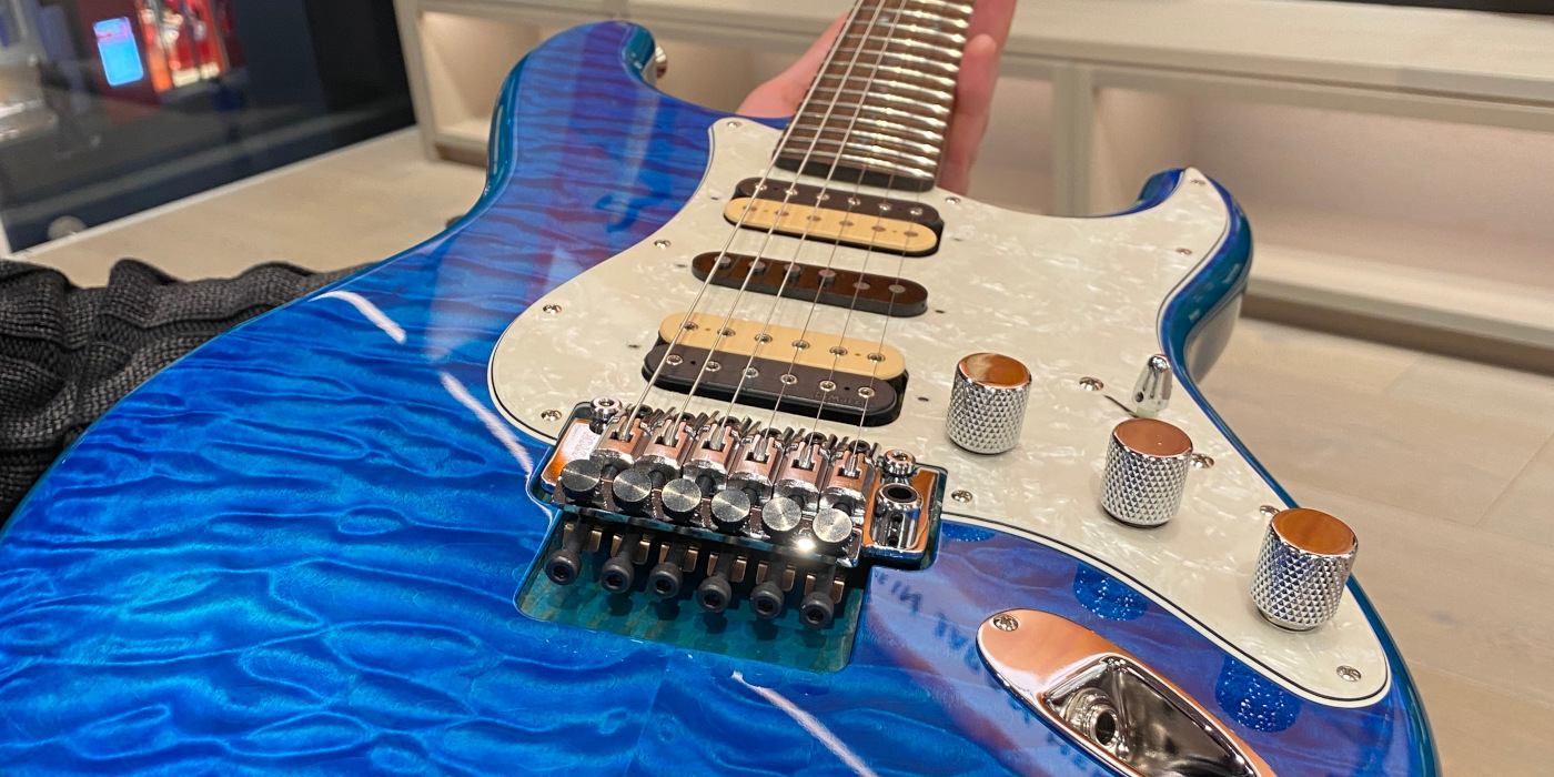A close up photo of the quilted maple top on the Fender Michiya Haruhata Stratocaster in Caribbean Blue Trans