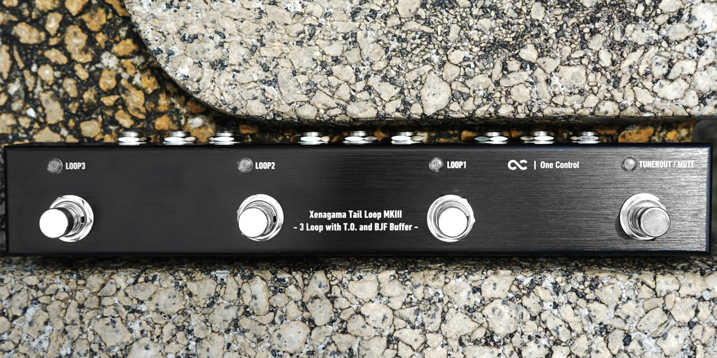 The One Control Xenagama Tail Loop MKIII pedal loop switcher on a stone floor