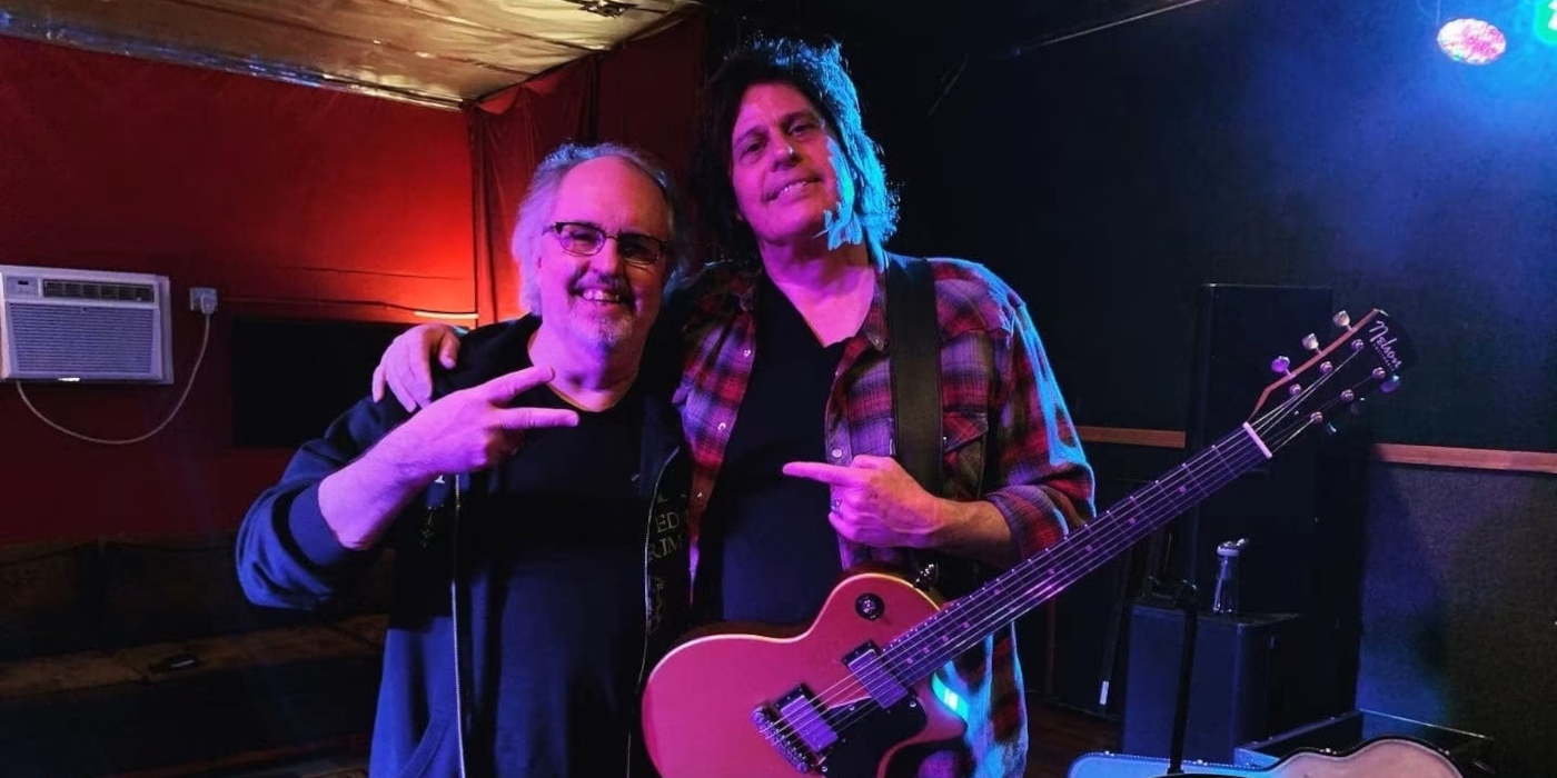 A photo of Steven Fryette standing next to Dean DeLeo of Stone Temple Pilots
