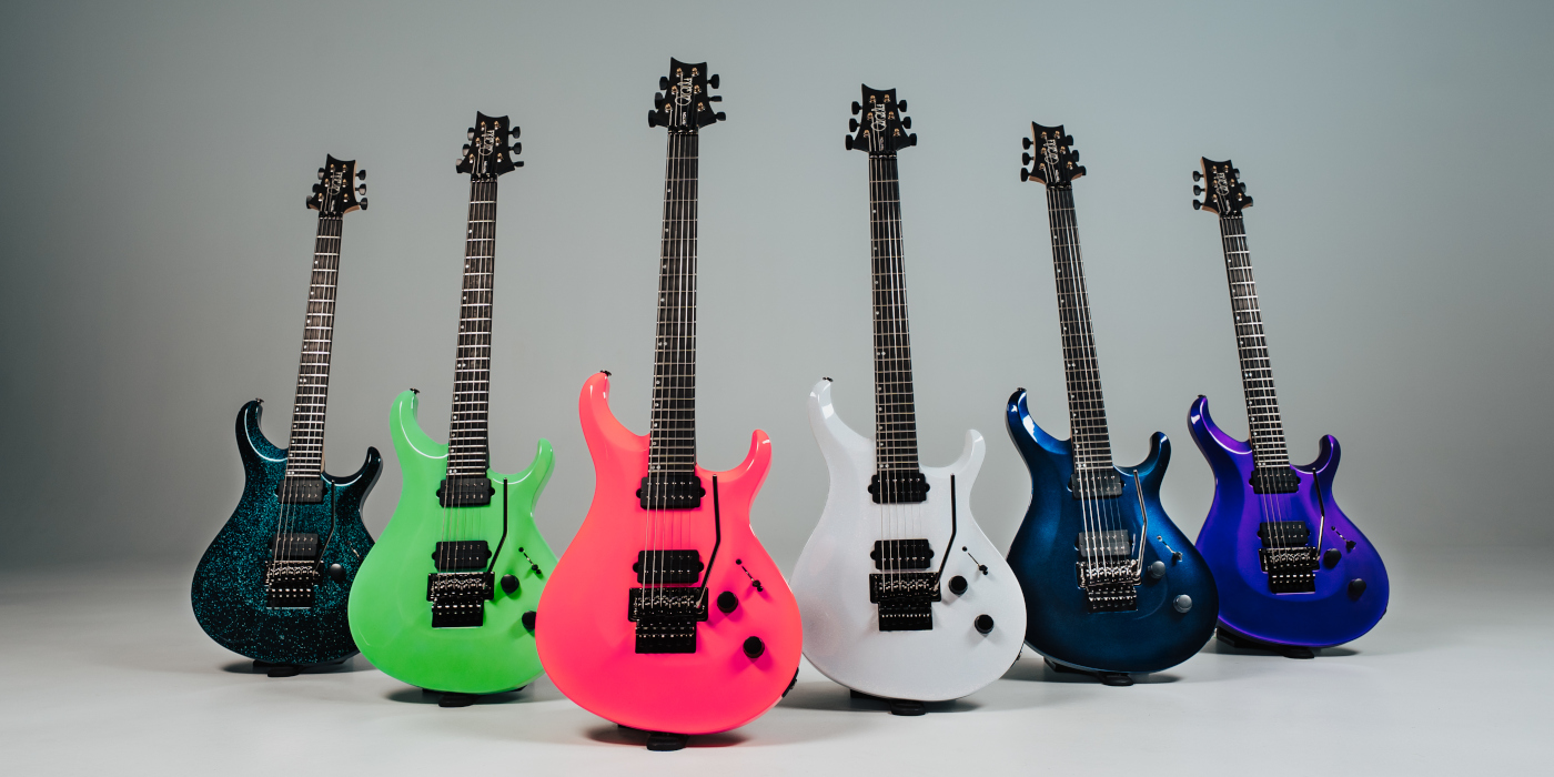 Six PRS Tekton Floyd Rose guitars in various vibrant finishes on a grey textured background